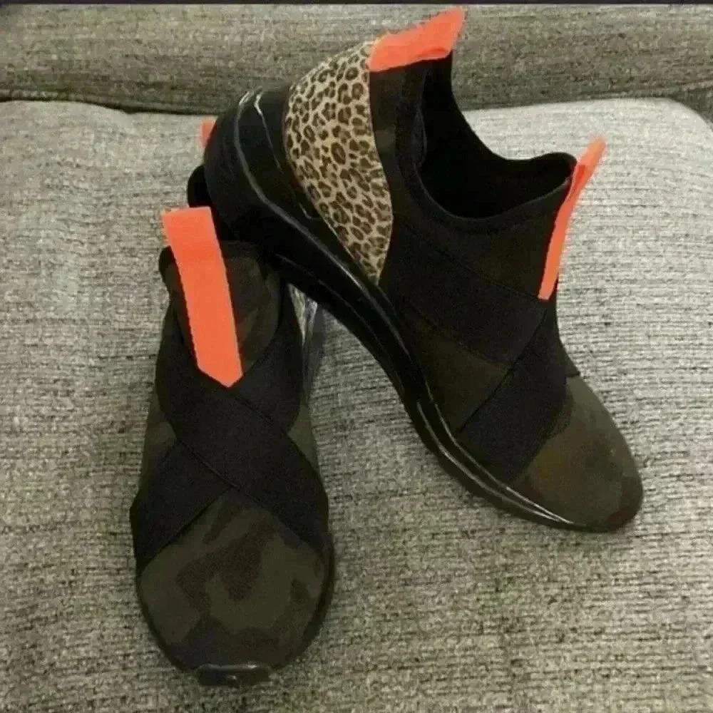 Steve Madden Mesh and neoprene fabric upper with wide crisscrossed instep bands